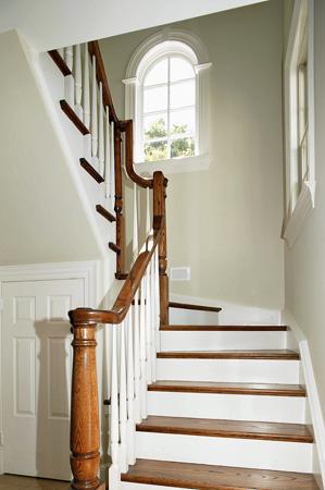 Bright, modern staircase with natural wood highlights